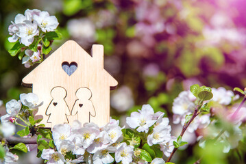 symbol of the house among the white apple blossoms
