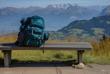 Backpack Resting On Viewpoint Bench, Peaks In Distance