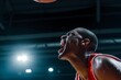 © altitudevisual - basketball player sweating profusely under indoor lights