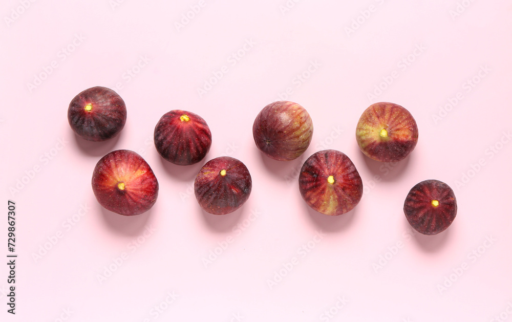 Ripe fresh figs on pink background