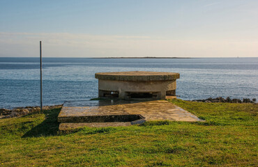 Wall Mural - A World War Two bunker on the coast of the Kasteja Forest Park - Park Suma Kasteja - in Medulin, Istria, Croatia. 