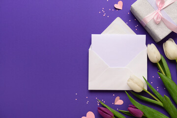 Wall Mural - Envelope with blank card, gift box and tulip flowers on purple background. International Women's Day celebration