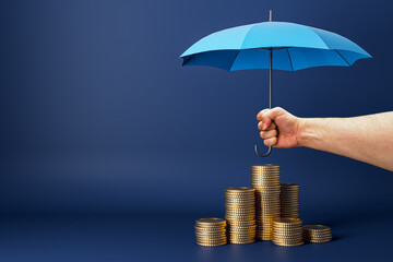 Fototapete - Abstract male hand holding umbrella over stacked coins on dark blue background with mock up place. Insurance and investment concept.