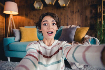 Sticker - Photo of cheerful astonished girl open mouth make selfie unbelievable news loft interior flat indoors