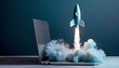 Blue rocket lifted off from a laptop on a desktop. startup concept