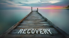 Recovery Concept On A Wooden Dock In The Middle Of The Ocean At Sunset, With The Word Recovery Written On It.  - 1
