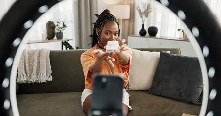 Poster - Video, influencer and black woman doing skincare for tutorial on social media or the internet. Dermatology, happy and young African female person filming or live streaming facial routine at home.