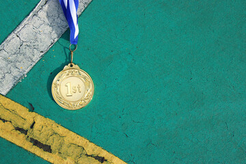 Wall Mural - top view image of medal on asphalt floor
