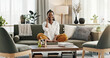 © Coetzee/peopleimages.com - Black woman on sofa, relax and phone call for good news, conversation and connection with smile in home. Happy girl on couch with smartphone, funny discussion and online chat in living room of house