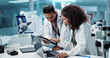 © Coetzee/peopleimages.com - Science, teamwork and scientist with tablet in laboratory for communication, pharmaceutical review or planning. Employees, collaboration and technology for research, discussion and digital analysis
