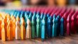 © Bartek - Colorful wooden figures standing in rows symbolizing diversity, unity, and inclusion within communities and teams in a social concept