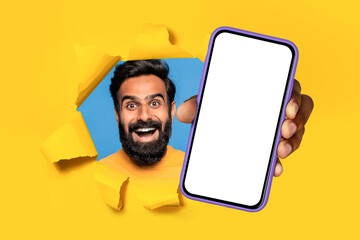 Poster - indian man showing smartphone screen through hole in yellow background