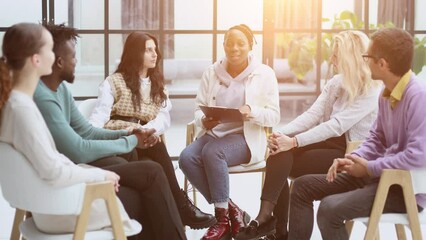 Wall Mural - Close-up of people chatting, sitting in a circle and gesturing