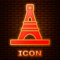 Poster - Glowing neon Eiffel tower icon isolated on brick wall background. France Paris landmark symbol. Vector