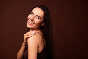 Sticker - Profile portrait of lovely nice girl arm touch shoulder toothy smile look empty space isolated on brown color background