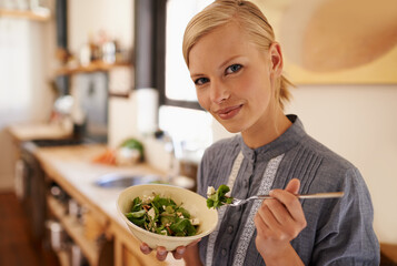 Poster - Woman, portrait and salad eating in kitchen or health nutrition for wellbeing, ingredients or fibre. Female person, face and bowl or vegetable meal in apartment for diet leafy greens, food or Canada