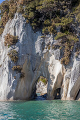 tunnel shaped rock in abel tasman in new zealand