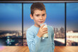 Boy Drinks Milk from a Glass