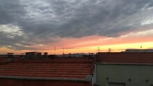 Beautiful Cloudy Sunset Over Terracotta Clay Tile Roofs