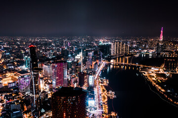 Canvas Print - Aerial drone photo - Skyline of Saigon (Ho Chi Minh City) at night. Vietnam