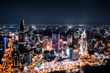 Wall Mural - Aerial drone photo - Skyline of Saigon (Ho Chi Minh City) at night. Vietnam