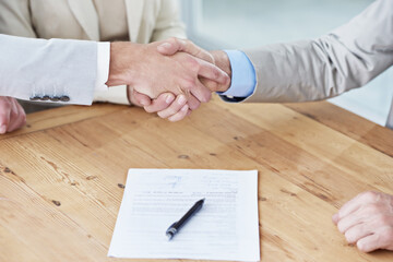 Canvas Print - Handshake, business people and contract, onboarding with human resources, meeting or interview at office. Paperwork, cooperation and partnership with signature, hiring and shaking hands for welcome