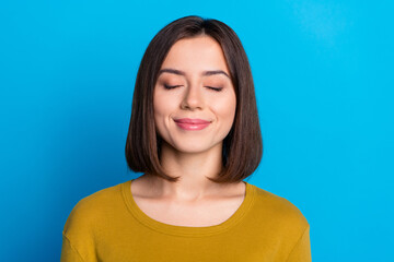 Wall Mural - Photo of dreamy adorable woman wear shirt smiling closed eyes sleeping isolated blue color background
