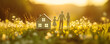 Abstract panoramic background of the model of family standing on the blooming field near their new house. Selling and buying home concept.