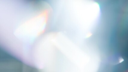 Wall Mural - Prismatic Light Effects. Loop. The light passes through the facets of a slowly rotating diamond and creates repetitive sparkling highlights and rainbow colors