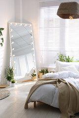 Wall Mural - Stylish mirror with light bulbs in modern bedroom. Interior design