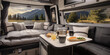 The interior of the RV camper van features a table and a bed, along with provisions for food, tableware, and even a window for enjoying the view. It's like a tiny movable house with a touch of art and