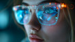 © Ekaterina - female Engineer designs AI technology with reflection on eyeglass lenses