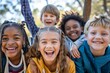 Portrait of smiling kids standing together in park on a sunny day
