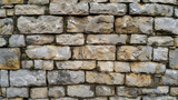 Fototapeta Desenie - Stone Wall Constructed From Small Rocks