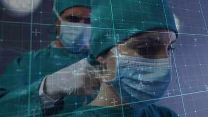 Canvas Print - Animation of data processing over diverse male and female surgeon preparing for operation