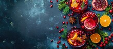 Text Space For Top View Of Holiday Sangria With Winter Fruits Such As Cranberries, Citrus, And Pomegranate.