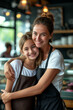 © S photographer - Caucasian mother and daughter hugging each other in a coffee shop.