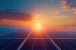Large solar panels at a solar farm at bright spring sunset