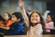 © Vorda Berge - Young girl raising hand in a elementary school classroom