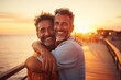 © Kate - a couple of men smile and take a selfie against the backdrop of the sea and sunset. The concept of a tourist holiday and summer mood, an unconventional couple.
