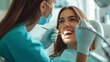 © Vitalii - Dentist pleased with woman's joyful dental procedure, ensuring a healthy smile.