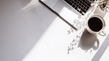 A laptop computer sitting on top of a white table