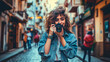 © juancajuarez - portrait of a young influencer and blogger woman with her camera in a city street with blurred background - content creator concept