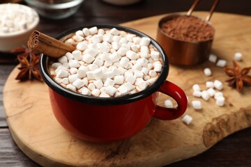 Wall Mural - Tasty hot chocolate with marshmallows on wooden table, closeup