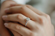 © Alina Zavhorodnii - Diamond engagement ring close-up on hand, marriage proposal