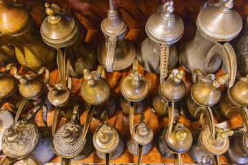 Wall Mural - Traditional brass and tin coffee pots in the Ushaiger Heritage Village.