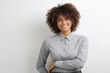 © Surachetsh - Confident, stylish and attractive young Afro-Black woman exudes happiness professionalism in a stock photo, dressed in business casual attire suitable for the office. Generative AI.
