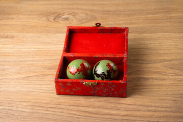 baoding balls inside the box on a table