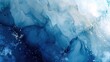© OLGA - Abstract painting of liquid ink on paper with a marbled blue and silver background.