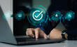 © CREATIVE WONDER - Businessman using laptop computer notebook connceting virtual online data check and approve. Technology and business concept.